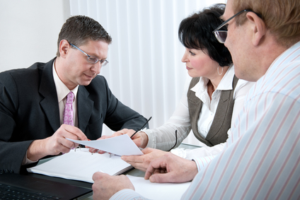 attorney reviewing paperwork with clients